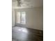Bright bedroom featuring neutral walls, dark floors, and a ceiling fan at 103 Tiburon Ct, Stonecrest, GA 30038