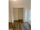 Open bi-fold closet doors reveal ample storage in this light and airy room at 103 Tiburon Ct, Stonecrest, GA 30038