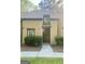 Inviting townhome exterior features a well-manicured front yard and classic architectural details at 103 Tiburon Ct, Stonecrest, GA 30038