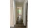 Hallway features a dark wood floor and doors to adjacent rooms at 103 Tiburon Ct, Stonecrest, GA 30038