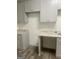 Modern kitchen features stylish cabinetry, granite countertops, and updated finishes at 103 Tiburon Ct, Stonecrest, GA 30038