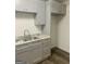Modern kitchen features stylish cabinetry, granite countertops, and updated finishes at 103 Tiburon Ct, Stonecrest, GA 30038