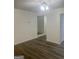 Open concept living space with hardwood floors and great natural light at 103 Tiburon Ct, Stonecrest, GA 30038
