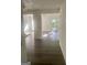 View of the open floor plan featuring hardwood floors and many windows at 103 Tiburon Ct, Stonecrest, GA 30038