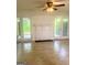Living room with fireplace, light-colored floors, and access to the backyard at 103 Tiburon Ct, Stonecrest, GA 30038