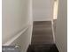 Staircase leading down to the lower level of the home with a white handrail at 103 Tiburon Ct, Stonecrest, GA 30038