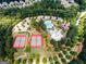Aerial view of community amenities featuring tennis courts, a pool, and clubhouse at 1429 Kentmire Court, Locust Grove, GA 30248