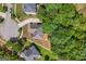 Aerial view of the roof of a two-story home with a backyard patio and mature trees at 1429 Kentmire Court, Locust Grove, GA 30248