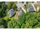 Aerial view of a two-story home with a tree-lined neighborhood in a cul-de-sac at 1429 Kentmire Court, Locust Grove, GA 30248