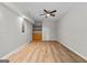 Basement featuring wood flooring, a ceiling fan, a closet, and shelving at 1429 Kentmire Court, Locust Grove, GA 30248