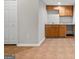Basement featuring tile flooring, a utility sink, and plenty of natural light at 1429 Kentmire Court, Locust Grove, GA 30248