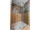 Shower featuring decorative tile walls and a clear glass door at 1429 Kentmire Court, Locust Grove, GA 30248