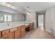 Spacious bathroom features double sinks, granite countertops, and tile flooring at 1429 Kentmire Court, Locust Grove, GA 30248