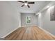 Bedroom featuring wood flooring, neutral walls, and a ceiling fan at 1429 Kentmire Court, Locust Grove, GA 30248