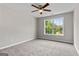 Bedroom features neutral paint, carpet, and a bright window at 1429 Kentmire Court, Locust Grove, GA 30248