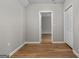 Bedroom featuring wood flooring, neutral walls, and a closet at 1429 Kentmire Court, Locust Grove, GA 30248