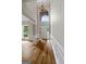 Elegant foyer featuring hardwood floors, wainscoting, and a dramatic arched window at 1429 Kentmire Court, Locust Grove, GA 30248