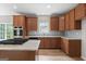 Well-lit kitchen with stainless steel appliances, granite counters, and ample cabinet space at 1429 Kentmire Court, Locust Grove, GA 30248