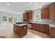 Modern kitchen with stainless steel appliances, granite countertops, and a center island at 1429 Kentmire Court, Locust Grove, GA 30248