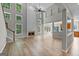 Spacious living room with hardwood floors, a fireplace, and large windows at 1429 Kentmire Court, Locust Grove, GA 30248