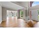 Bright living room featuring hardwood floors, large windows, and an open floor plan at 1429 Kentmire Court, Locust Grove, GA 30248