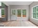 Sun room featuring a door to a deck and many windows for natural light at 1429 Kentmire Court, Locust Grove, GA 30248