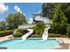 Exciting water slides leading into a sparkling pool, offering a thrilling aquatic adventure for all ages at 1429 Kentmire Court, Locust Grove, GA 30248