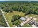 Expansive aerial view showcasing the property's lush greenery and surrounding wooded landscape for a serene living experience at 203 Brannan Rd, Mcdonough, GA 30253