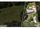 Aerial view of property with a detached garage, house, and long driveway at 203 Brannan Rd, Mcdonough, GA 30253