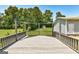Large back deck with a wooden railing offers a relaxing outdoor space at 203 Brannan Rd, Mcdonough, GA 30253