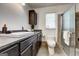 Well-maintained bathroom featuring a modern vanity, updated shower, and stylish fixtures at 203 Brannan Rd, Mcdonough, GA 30253