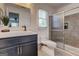 Well-lit bathroom with a modern vanity, tiled shower, and contemporary fixtures offering a spa-like experience at 203 Brannan Rd, Mcdonough, GA 30253