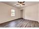 Simple bedroom with natural light, wood floors, and a closet providing a clean and inviting space at 203 Brannan Rd, Mcdonough, GA 30253