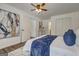 Comfortable bedroom with a plush bed, blue accents, closet, and stylish decor creating a serene atmosphere at 203 Brannan Rd, Mcdonough, GA 30253