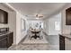 Bright dining room featuring a round table, elegant chairs, and an open layout leading to other living spaces at 203 Brannan Rd, Mcdonough, GA 30253