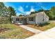 Charming home exterior with a porch, well-maintained lawn, and inviting curb appeal in a residential neighborhood at 203 Brannan Rd, Mcdonough, GA 30253