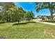Inviting single-story house with green lawn and trees provides curb appeal at 203 Brannan Rd, Mcdonough, GA 30253