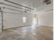 Spacious, empty two-car garage with concrete floor and utility door, ready for customization at 203 Brannan Rd, Mcdonough, GA 30253