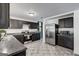 Bright kitchen with stainless steel appliances, tile floor, and dark wood cabinets at 203 Brannan Rd, Mcdonough, GA 30253