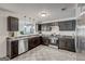 Well-lit kitchen with ample counter space, stainless steel appliances, and modern fixtures at 203 Brannan Rd, Mcdonough, GA 30253