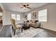 Comfortable living room featuring modern decor, neutral tones, and light gray laminate floors at 203 Brannan Rd, Mcdonough, GA 30253