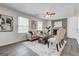 Cozy living room featuring a fireplace, neutral tones, and light gray laminate floors at 203 Brannan Rd, Mcdonough, GA 30253