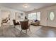 Cozy living room with stylish furniture, wood floors, and abundant natural light at 203 Brannan Rd, Mcdonough, GA 30253