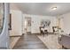 Open living room with wood floors, contemporary decor, and plenty of natural light at 203 Brannan Rd, Mcdonough, GA 30253