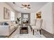 Living room showcasing modern decor, fireplace, neutral tones, and light gray laminate floors at 203 Brannan Rd, Mcdonough, GA 30253