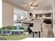 Open-concept design with dining and kitchen area featuring modern appliances and stylish decor at 203 Brannan Rd, Mcdonough, GA 30253