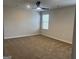 Bedroom featuring neutral walls and carpet, and natural light from a window and ceiling fan at 5314 Tolar Rd # 23, South Fulton, GA 30213