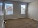 Light-filled bedroom offers two windows, neutral walls, and plush carpeting at 5314 Tolar Rd # 23, South Fulton, GA 30213