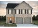 Charming two-story brick home with a two-car garage and black shutters at 5314 Tolar Rd # 23, South Fulton, GA 30213