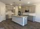 Modern kitchen featuring stainless steel appliances, granite countertops, and an island with a sink at 5314 Tolar Rd # 23, South Fulton, GA 30213